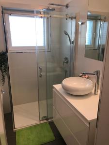 a bathroom with a shower and a sink at Apartments Don in Vantačići