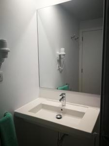 Een badkamer bij Bungalows Vistalmar