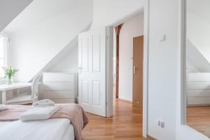 Posteľ alebo postele v izbe v ubytovaní Riviera Residence Apartments