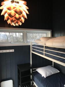 Postel nebo postele na pokoji v ubytování Steigen Lodge Sjøhytter