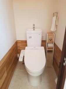 a bathroom with a white toilet in a room at M's Kanazawa in Kanazawa