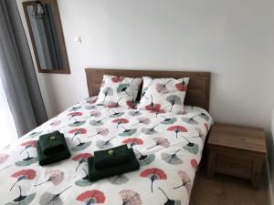 Posteľ alebo postele v izbe v ubytovaní Grand Apartament