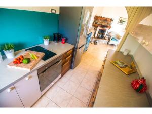a kitchen with a counter with a cutting board on it at Villa Mikula in Maslinica