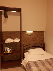 Postel nebo postele na pokoji v ubytování Hotel Trifylia