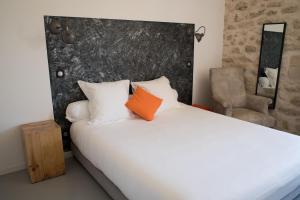 Postel nebo postele na pokoji v ubytování Hôtel Le 23
