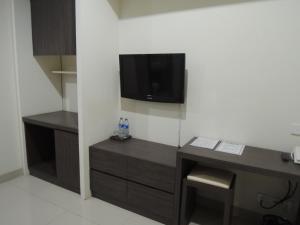 TV a/nebo společenská místnost v ubytování Harlys Residence