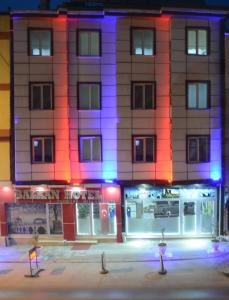 a building with colored lights in front of it at Balkan Palace Edirne in Edirne