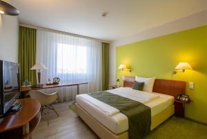 Postel nebo postele na pokoji v ubytování Globana Airport Hotel + 37 fotografií