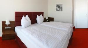 Business Hotel Ambio Gleisdorf客房内的一张或多张床位