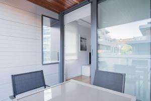 a dining room with a table and two chairs at GOXUE HOME in Donostia-San Sebastián