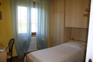 Posteľ alebo postele v izbe v ubytovaní La casa di Rachele