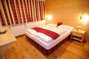 Postel nebo postele na pokoji v ubytování Chalet Regina