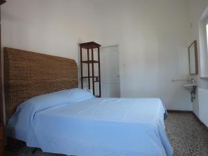 A bed or beds in a room at Villa Mattera