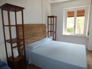 A bed or beds in a room at Villa Mattera