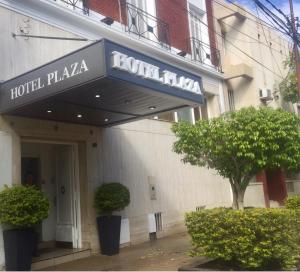 a hotel plaza sign on the side of a building at Hotel Plaza San Juan in San Juan