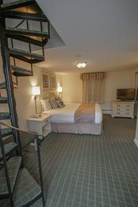 Voodi või voodid majutusasutuse Cape Winds Resort, a VRI resort toas