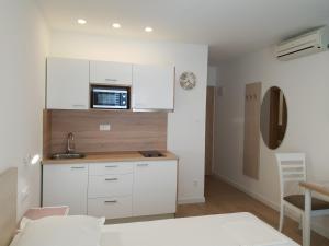 Kuchyň nebo kuchyňský kout v ubytování Guesthouse Dominović