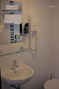 Koupelna v ubytování Hotel Allure