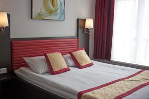 Postel nebo postele na pokoji v ubytování Hotel Allure