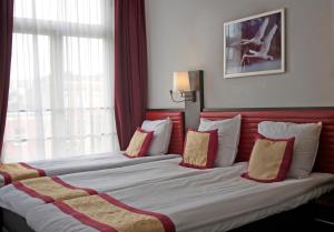 Postel nebo postele na pokoji v ubytování Hotel Allure