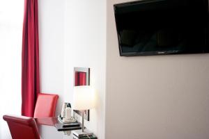 TV a/nebo společenská místnost v ubytování Hotel Allure