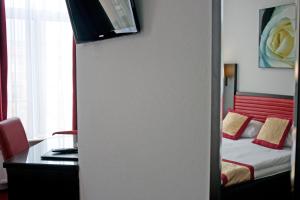 Postel nebo postele na pokoji v ubytování Hotel Allure