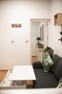 a living room with a couch and a table at NICE HOME city center in Melilla