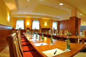 a large conference room with a long wooden table at Posthotel Radstadt in Radstadt