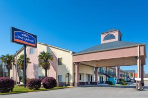 a hotel with a sign in front of a building at Howard Johnson by Wyndham Rock Hill in Rock Hill