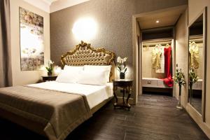 a hotel room with a bed and a bathroom at Hotel Valadier in Rome
