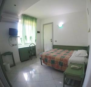 Postel nebo postele na pokoji v ubytování Hotel Rosetta