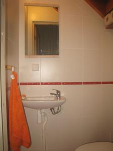 a bathroom with a sink and a mirror at Sae Hostel in Võsu