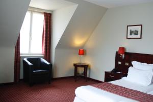Postel nebo postele na pokoji v ubytování Hotel Restaurant Weinebrugge