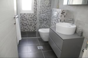 Ein Badezimmer in der Unterkunft Apartman Ivana