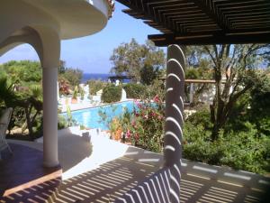 a view from the porch of a house with a swimming pool at Oasi Di Casablanca in Lampedusa