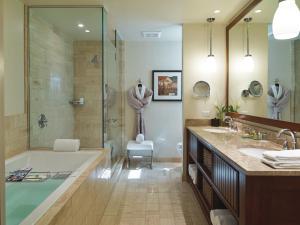 a bathroom with a tub and a sink and a shower at Inn By the Sea in Cape Elizabeth