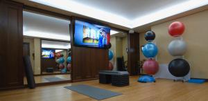 a room with balloons and a flat screen tv at Inn By the Sea in Cape Elizabeth