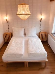 Ένα ή περισσότερα κρεβάτια σε δωμάτιο στο Charmantes Loft mit ganz besonderem Flair +17 φωτογραφίες