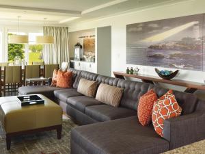 a living room with a couch and a table at Inn By the Sea in Cape Elizabeth
