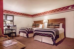 a bedroom with a bed and a dresser at Inn & Spa at Loretto in Santa Fe