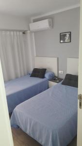 Postel nebo postele na pokoji v ubytování Guesthouse Central