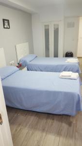 Postel nebo postele na pokoji v ubytování Guesthouse Central