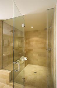 a shower with a glass door in a bathroom at Inn By the Sea in Cape Elizabeth