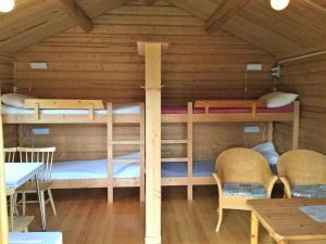 a room with two bunk beds in a cabin at Harran Camping in Grong