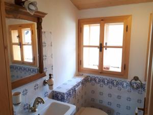 a bathroom with a sink and a toilet at Chalupa Pomněnka in Komorní Lhotka +14 photos