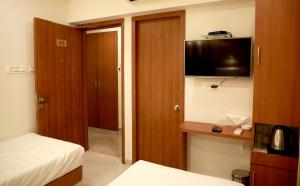 Postel nebo postele na pokoji v ubytování Hotel Lords, Fort