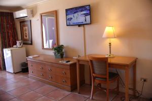 TV o dispositivi per l'intrattenimento presso Heritage Hotel