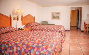 Letto o letti in una camera di Heritage Hotel