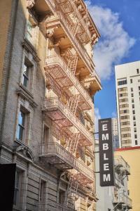a building with fire escapes on the side of it at Hotel Emblem San Francisco, a Viceroy Urban Retreat in San Francisco