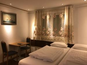 Voodi või voodid majutusasutuse TU Ferienzimmer in Ulm Stadtmitte toas